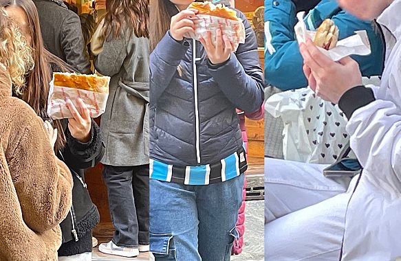 Turisti mangiano schiacciata a Firenze - foto Blue Lama